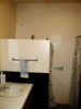 Starr House bathroom. Mold and mildew growth, paint peeling off walls.