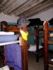 Starr House dormitory. Mold on ceiling, 3-inch foam pads on bunk beds.